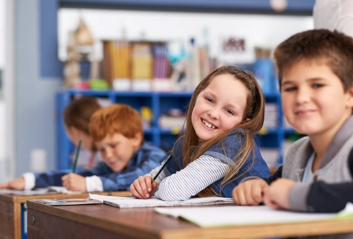 Cropped shot of elementary school children in class