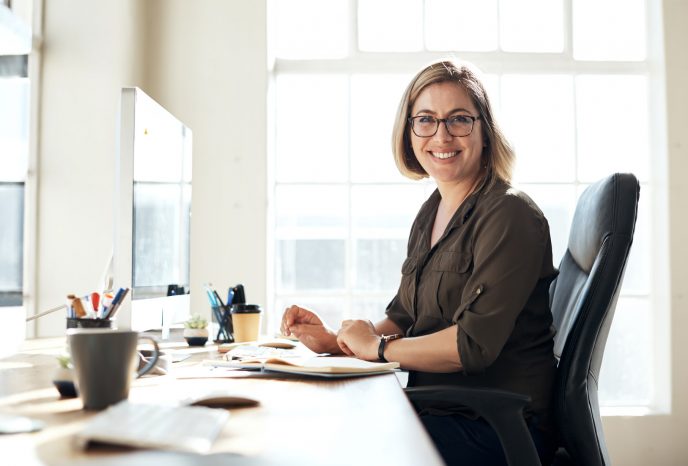 Portrait of a young businesswoman working on a computer in an office